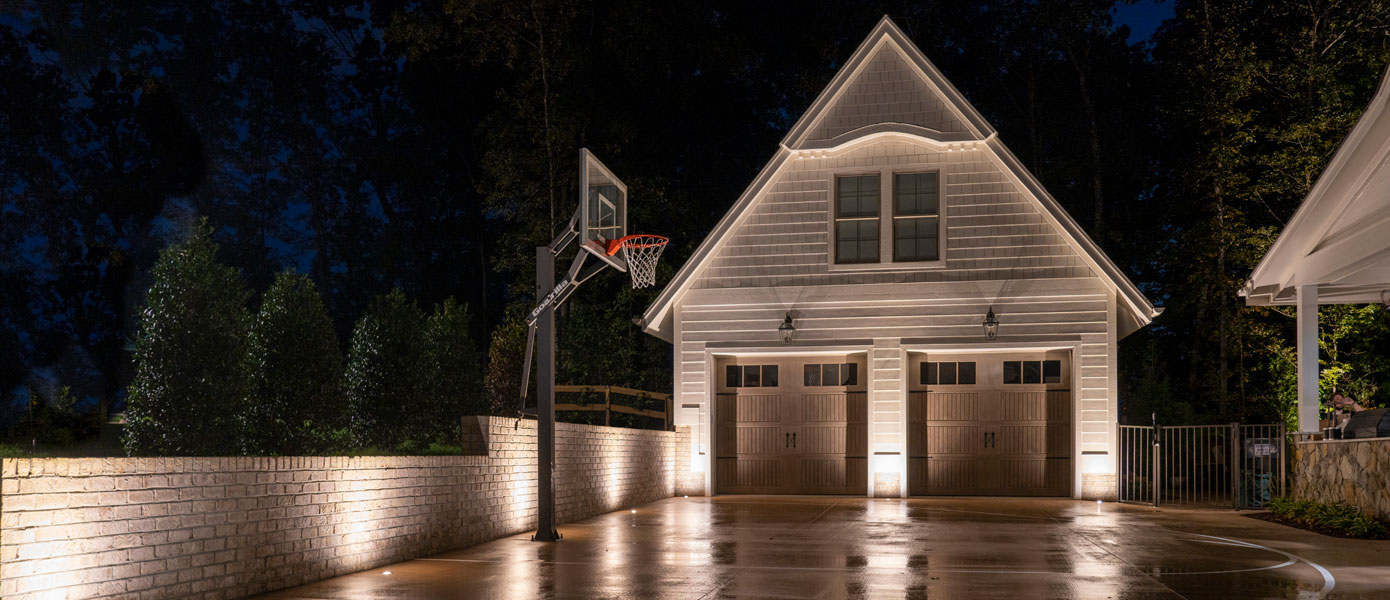 A basketball hoop in front of a houseDescription automatically generated with medium confidence